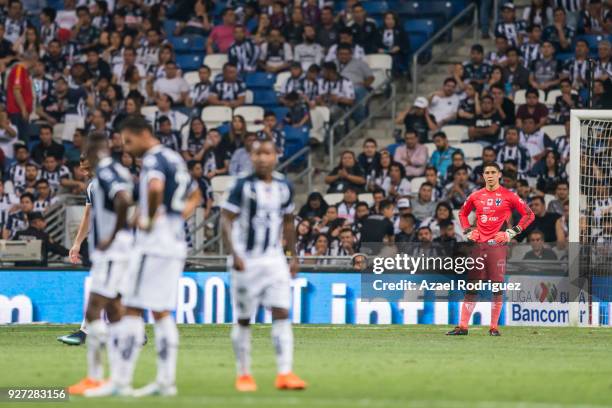 Players of Monterrey react after Lucas Cavallini of Puebla scored the third goal of his team during the 10th round match between Monterrey and Puebla...