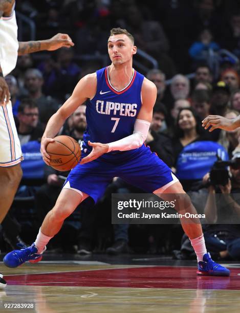 Sam Dekker of the Los Angeles Clippers holds on to a rebound during the game against the New York Knicks at Staples Center on March 2, 2018 in Los...