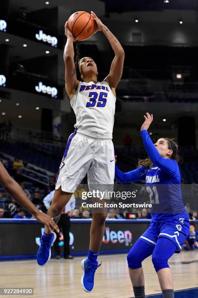 DePaul Blue Demons forward Mart'e Grays shoots over Seton Hall Pirates guard Nicole Jimenez during the game on March 4, 2018 at the Wintrust Arena in...