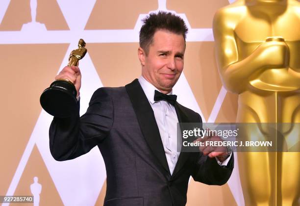 Actor Sam Rockwell poses in the press room with the Oscar for Best Actor in Supporting Role during the 90th Annual Academy Awards on March 4 in...