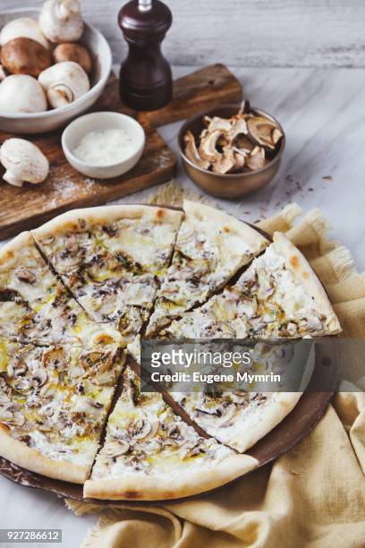 pizza with field mushrooms, porcini mushrooms, mozzarella and truffle sauce - field mushroom stock pictures, royalty-free photos & images