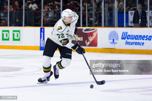 London Knights Defenceman Alec Regula skates the puck into the attacking zone during Ontario Hockey League action between the London Knights and...