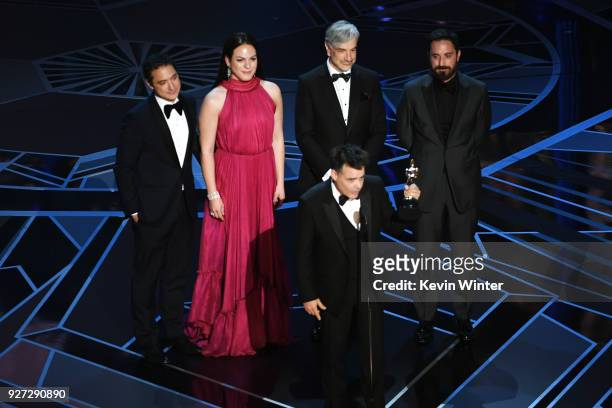 Director Sebastian Lelio accepts Best Foreign Language Film for 'A Fantastic Woman' with cast/crew onstage during the 90th Annual Academy Awards at...