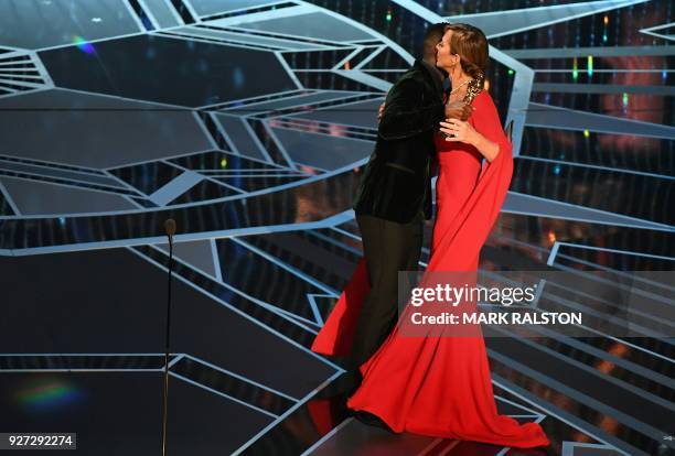 Actress Allison Janney accepts the Oscar for Best Supporting Actress in "I, Tonya" from actor Mahershala Ali during the 90th Annual Academy Awards...