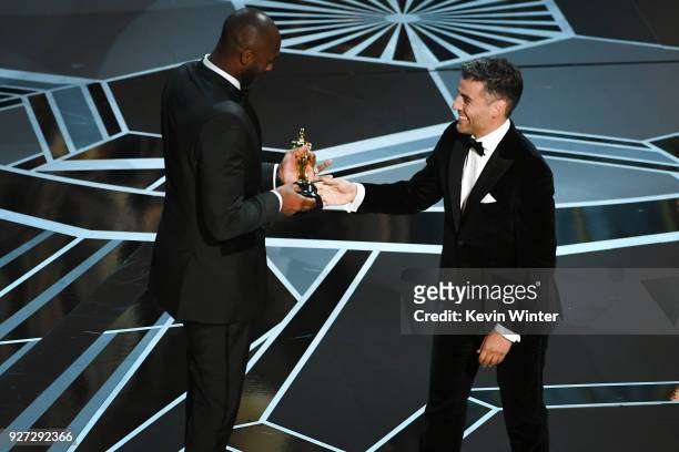 Filmmaker Kobe Bryant accepts Best Animated Short Film for 'Dear Basketball' from actor Oscar Isaac onstage during the 90th Annual Academy Awards at...