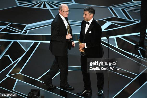 Filmmaker Glen Keane accepts Best Animated Short Film for 'Dear Basketball' from actor Oscar Isaac onstage during the 90th Annual Academy Awards at...