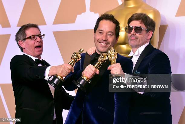 Set decorator Jeffrey A. Melvin, production designer Paul Denham Austerberry, and set decorator Shane Vieau, winners of the Best Production Design...