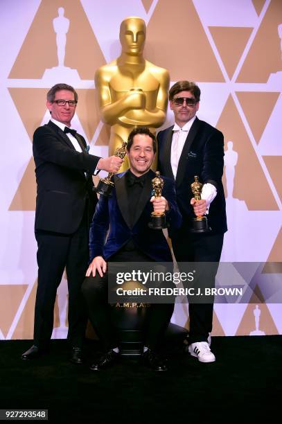 Set decorator Jeffrey A. Melvin, production designer Paul Denham Austerberry, and set decorator Shane Vieau, winners of the Best Production Design...