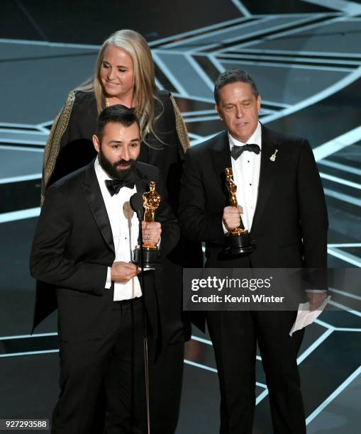 Filmmakers Adrian Molina, Darla K. Anderson and Lee Unkrich accept Best Animated Feature Film for 'Coco' onstage during the 90th Annual Academy...