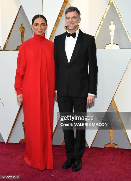 Actress Maya Rudolph and Director Paul Thomas Anderson arrive for the 90th Annual Academy Awards on March 4 in Hollywood, California. / AFP PHOTO /...