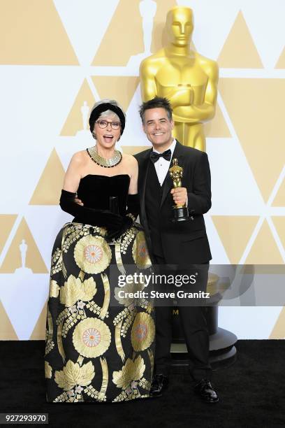 Actor Rita Moreno and director Sebastián Lelio, winner of the Foreign Language Film award for A Fantastic Woman poses in the press room during the...