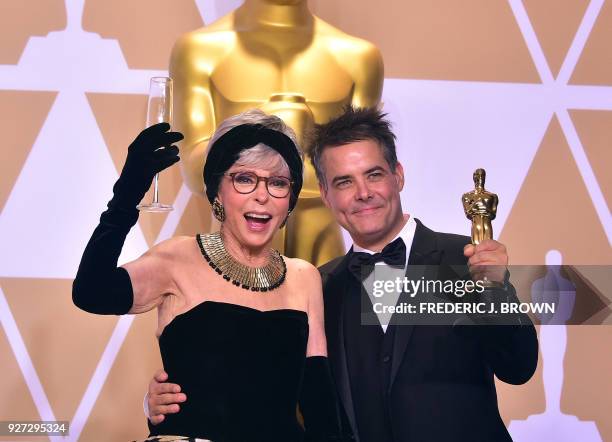 Actress Rita Moreno and director Sebastián Lelio pose in the press room with the Oscar for Best Foreign Language Film during the 90th Annual Academy...