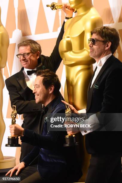Set decorator Jeffrey A. Melvin, production designer Paul Denham Austerberry, and set decorator Shane Vieau, winners of the Best Production Design...