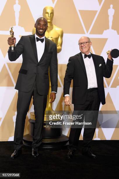Filmmakers Kobe Bryant and Glen Keane, winners of the Best Animated Short Film award for 'Dear Basketball,' pose in the press room during the 90th...