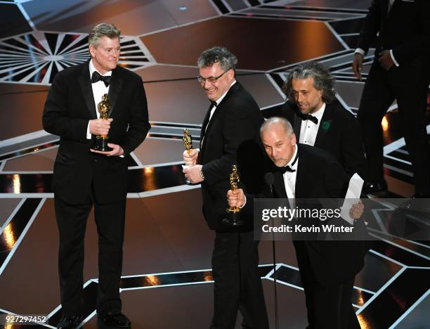 Visual effects artists Richard R. Hoover, Gerd Nefzer, John Nelson, and Paul Lambert accept Best Visual Effects for 'Blade Runner 2049' onstage...