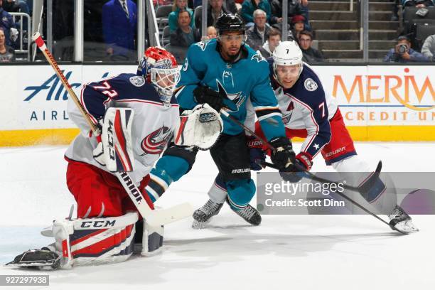 Sergei Bobrovsky and Jack Johnson of the Columbus Blue Jackets defend Evander Kane of the San Jose Sharks at SAP Center on March 4, 2018 in San Jose,...
