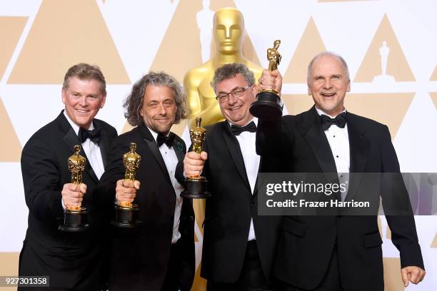 Visual effects artists Richard R. Hoover, Paul Lambert, Gerd Nefzer, and John Nelson, winners of the Best Visual Effects award for 'Blade Runner...