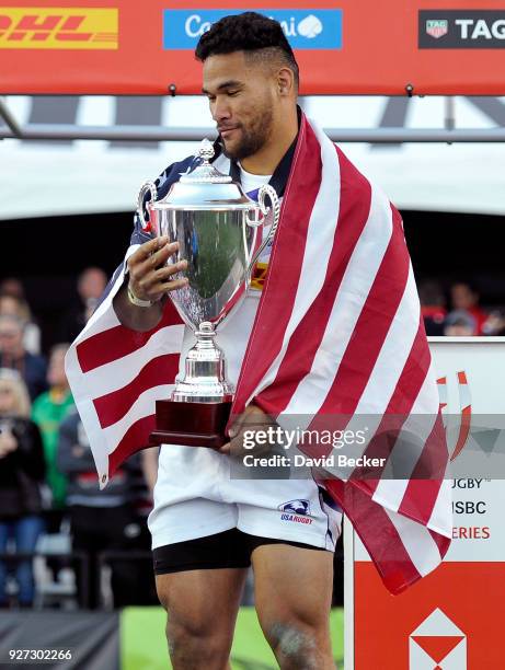 Martin Iosefo of the United States holds the Cup Final trophy after the team defeated Argentina in the HSBC USA Sevens at Sam Boyd Stadium on March...