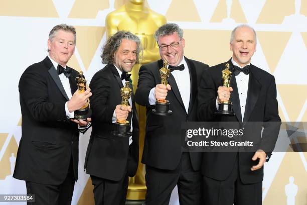 Visual effects artists Richard R. Hoover, Paul Lambert, Gerd Nefzer and John Nelson, winners of the Best Visual Effects award for "'Blade Runner...