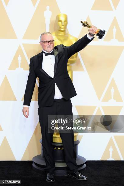 Film editor Lee Smith, winner of the Film Editing award for "Dunkirk" poses in the press room during the 90th Annual Academy Awards at Hollywood &...