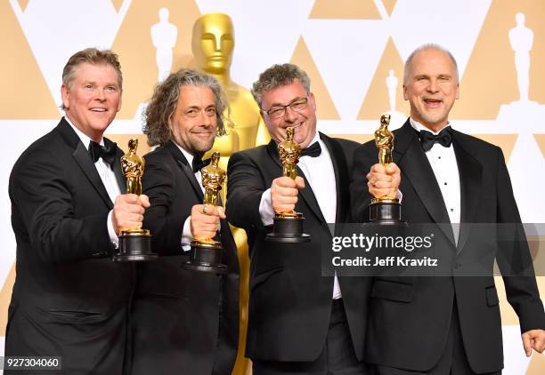 Visual effects artists Richard R. Hoover, Paul Lambert, Gerd Nefzer and John Nelson, winners of the Best Visual Effects award for "'Blade Runner...