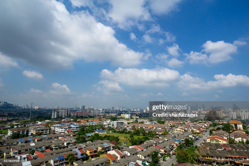 A clear and windy day in Kuala Lumpur, capital of Malaysia. Its modern skyline is dominated by the 451m tall KLCC, a pair of glass and steel clad skyscrapers.