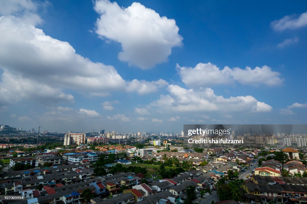 A clear and windy day in Kuala Lumpur, capital of Malaysia. Its modern skyline is dominated by the 451m tall KLCC, a pair of glass and steel clad skyscrapers.