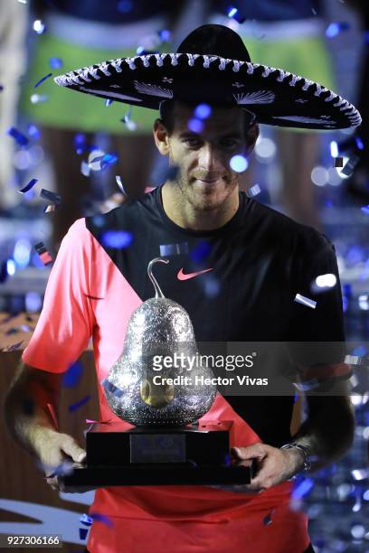 Juan Martin del Potro of Argentina celebrates with the champions trophy after winning the Championship match between Kevin Anderson of South Africa...
