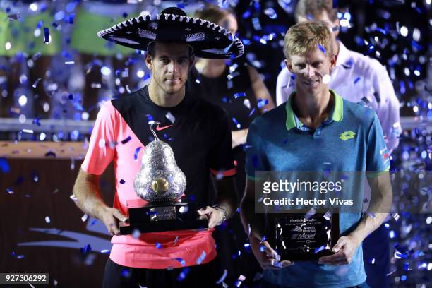 Juan Martin del Potro of Argentina and Kevin Anderson of South Africa pose after the Championship match between Kevin Anderson of South Africa and...