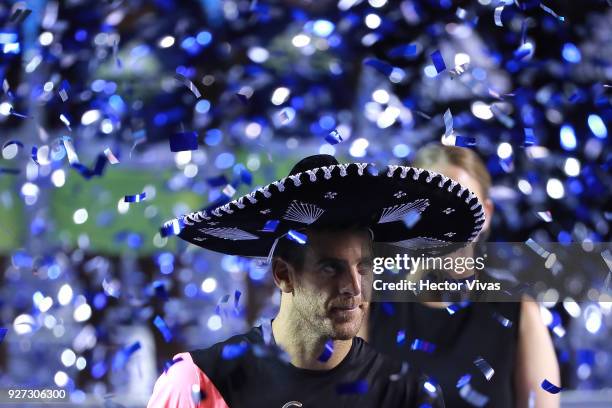 Juan Martin del Potro of Argentina celebrates with the champion trophy after the Championship match between Kevin Anderson of South Africa and Juan...