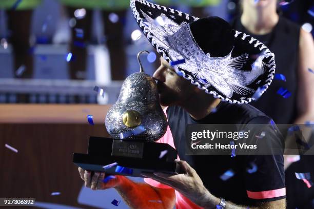 Juan Martin del Potro of Argentina kisses the champion trophy after the Championship match between Kevin Anderson of South Africa and Juan Martin del...