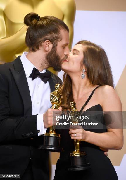 Filmmakers Chris Overton and Rachel Shenton, winners of the Best Live Action Short Film award for 'The Silent Child,' pose in the press room during...