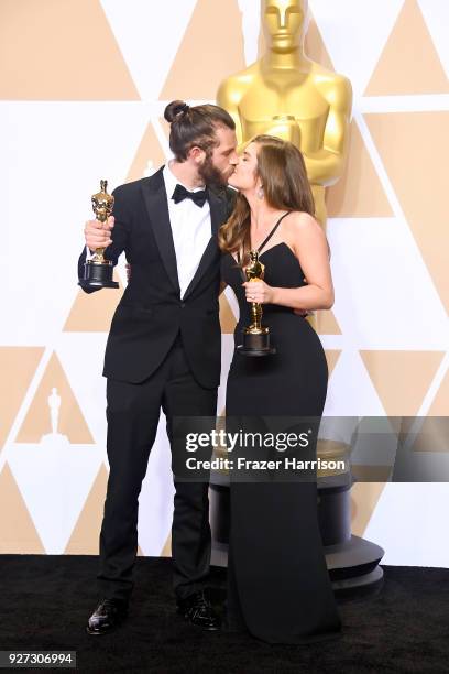 Filmmakers Chris Overton and Rachel Shenton, winners of the Best Live Action Short Film award for 'The Silent Child,' pose in the press room during...