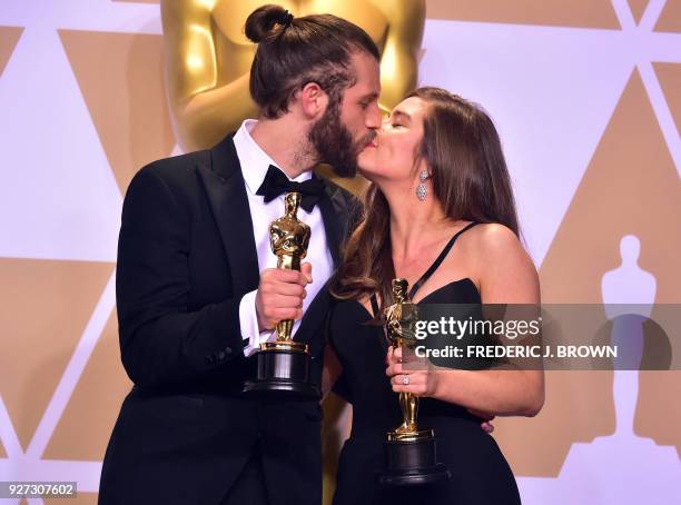 British actor and producer Chris Overton and British actress Rachel Shenton poses in the press room with the Oscar for Best Live Action Short Film...