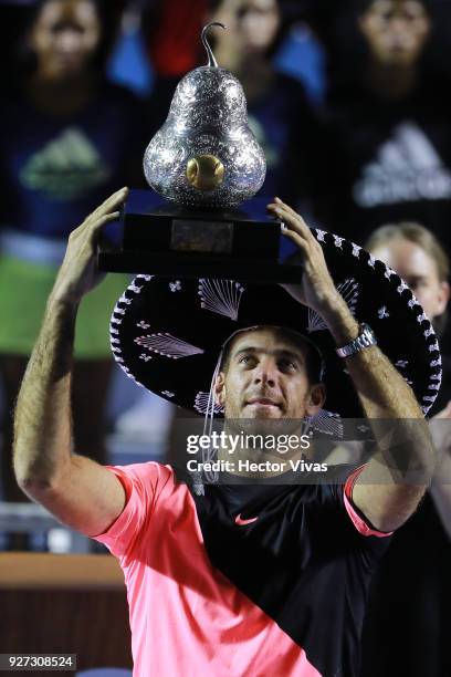 Juan Martin del Potro of Argentina celebrates with the champions trophy after winning the Championship match between Kevin Anderson of South Africa...