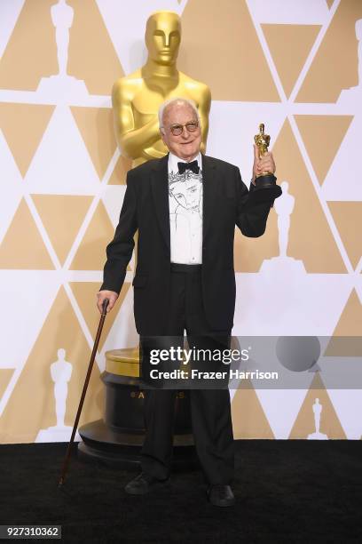 Writer James Ivory, winner of the Best Adapted Screenplay award for 'Call Me By Your Name,' poses in the press room during the 90th Annual Academy...