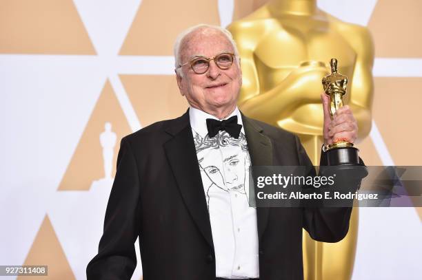 Writer James Ivory, winner of the Best Adapted Screenplay award for 'Call Me By Your Name,' poses in the press room during the 90th Annual Academy...