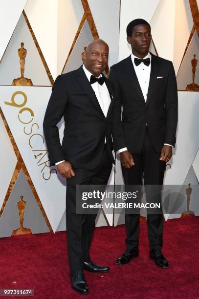 John Singleton and Damson Idris arrive for the 90th Annual Academy Awards on March 4 in Hollywood, California. / AFP PHOTO / VALERIE MACON