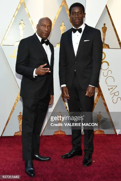 John Singleton and Damson Idris arrive for the 90th Annual Academy Awards on March 4 in Hollywood, California. / AFP PHOTO / VALERIE MACON
