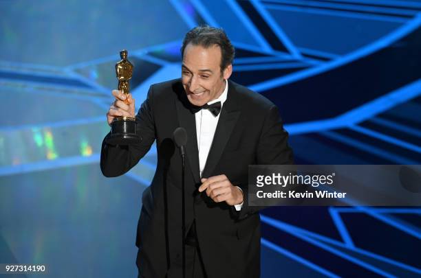 Composer Alexandre Desplat accepts Best Original Score for 'The Shape of Water' onstage during the 90th Annual Academy Awards at the Dolby Theatre at...