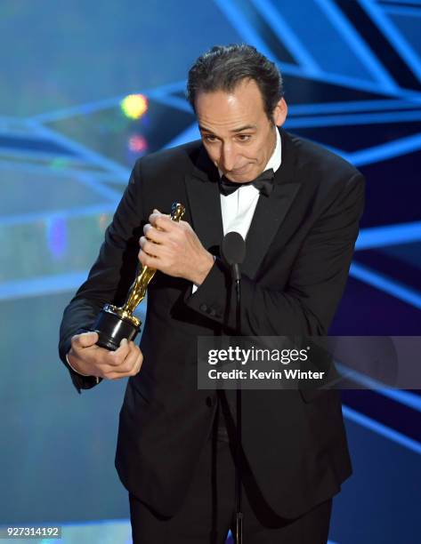 Composer Alexandre Desplat accepts Best Original Score for 'The Shape of Water' onstage during the 90th Annual Academy Awards at the Dolby Theatre at...