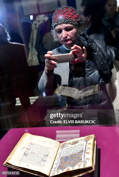 This photograph taken on February 22 shows visitors to The National Museum of Bosnia and Herzegovina, in Sarajevo, which has revealed a new space...