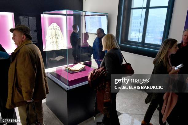 This photograph taken on February 22 shows visitors to The National Museum of Bosnia and Herzegovina, in Sarajevo, which has revealed a new space...