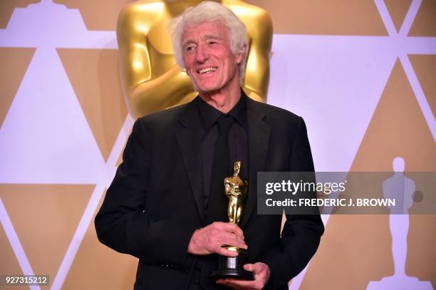 Roger A. Deakins poses in the press room with the Oscar for Best Cinematography for "Blade Runner 2049," during the 90th Annual Academy Awards on...