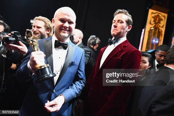 In this handout provided by A.M.P.A.S., David Malinowski and Armie Hammer attend the 90th Annual Academy Awards at the Dolby Theatre on March 4, 2018...