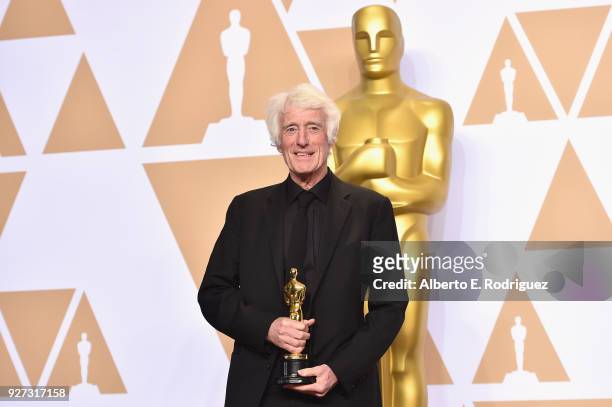 Cinematographer Roger Deakins winner of the Best Cinematography for "Blade Runner" poses in the press room during the 90th Annual Academy Awards at...