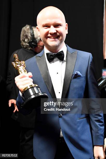 In this handout provided by A.M.P.A.S., David Malinowski winner Best Makeup and Hairstyling for 'Darkest Hour' attends the 90th Annual Academy Awards...