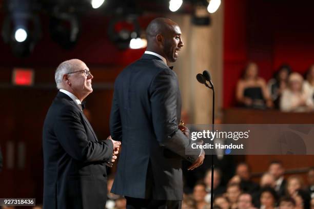 In this handout provided by A.M.P.A.S., Glen Keane and Kobe Bryant attend the 90th Annual Academy Awards at the Dolby Theatre on March 4, 2018 in...