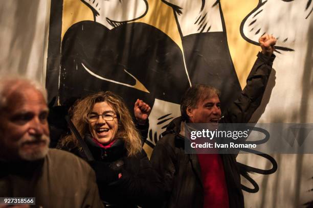 Party militants Power to the world within the former EX OGP social center during the counting of the paper ballots on March 4, 2018 in Naples, Italy....