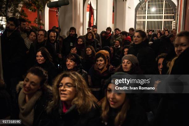 Party militants Power to the world within the former EX OGP social center during the counting of the paper ballots on March 4, 2018 in Naples, Italy....